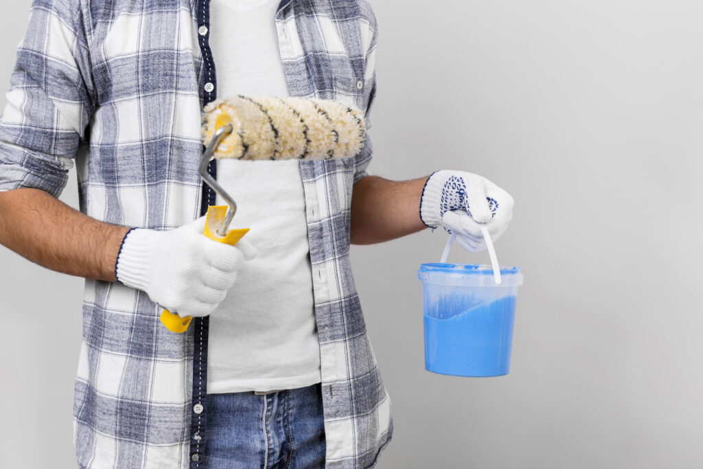 Painters using scaffolding for high-rise commercial painting